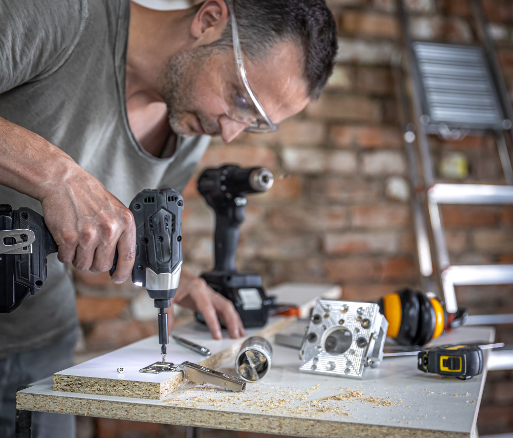 screwing-self-tapping-screw-into-metal-fastening-hole-wood-strip-using-screwdriver-work-carpenter
